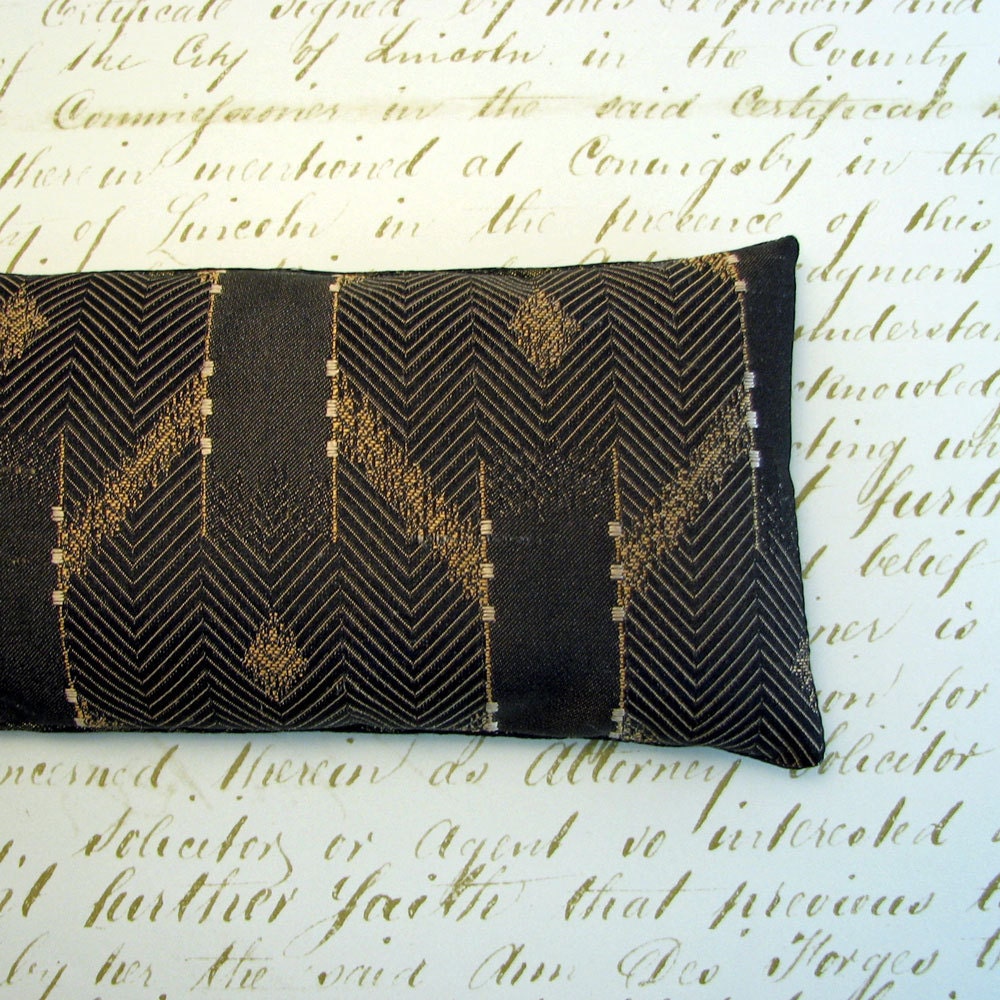 Lavender and Flax seed eye pillow in black and bronze ikat stripe
