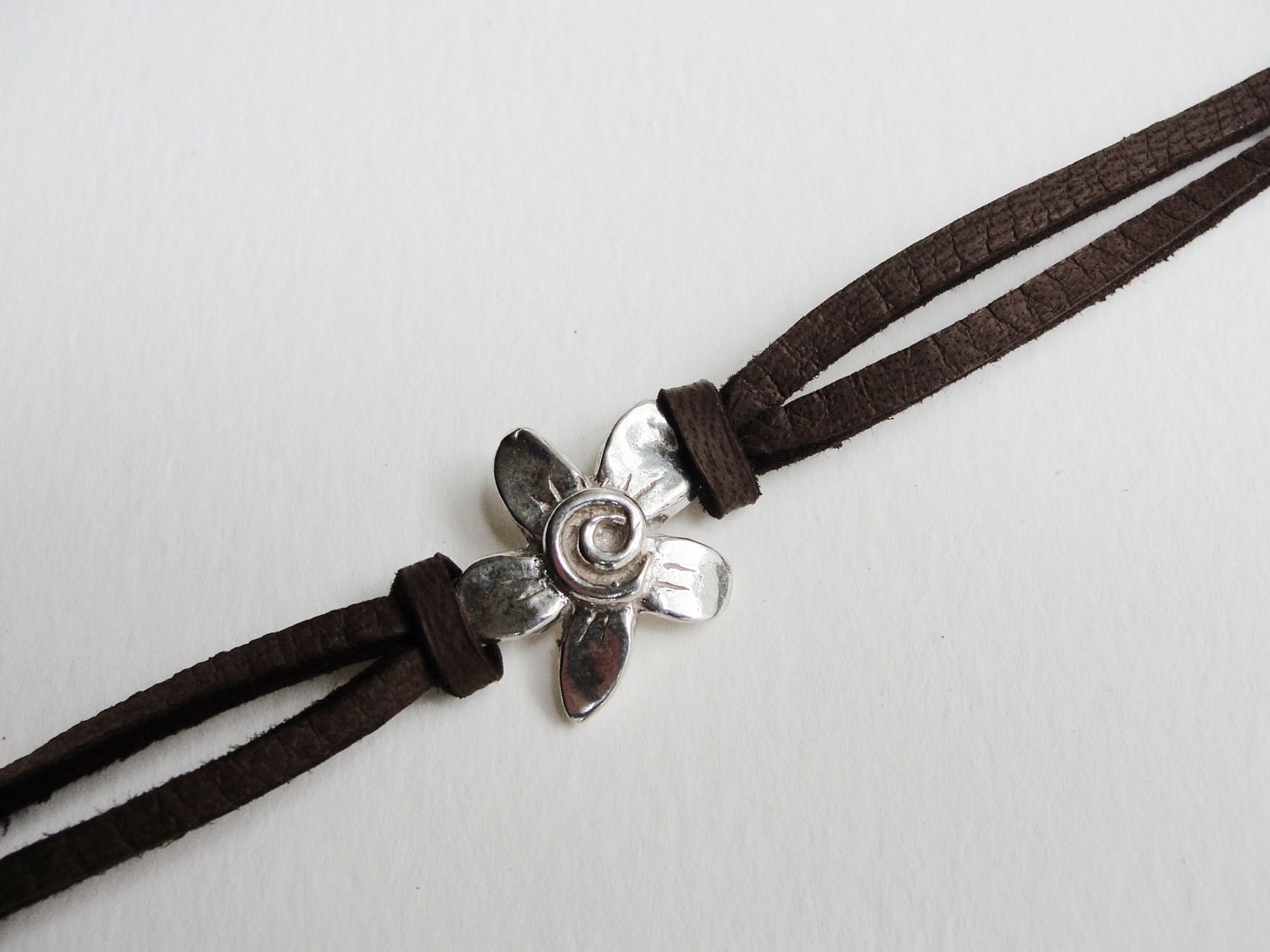 Sterling Spiral Fleur on Leather bracelet
