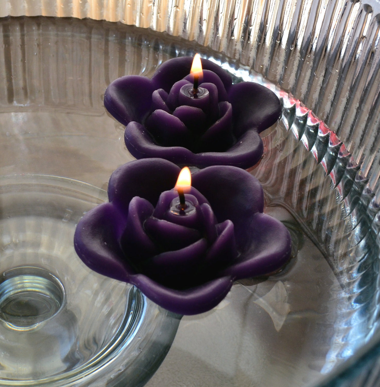 12 Purple floating rose wedding candles for table centerpiece and reception decor.