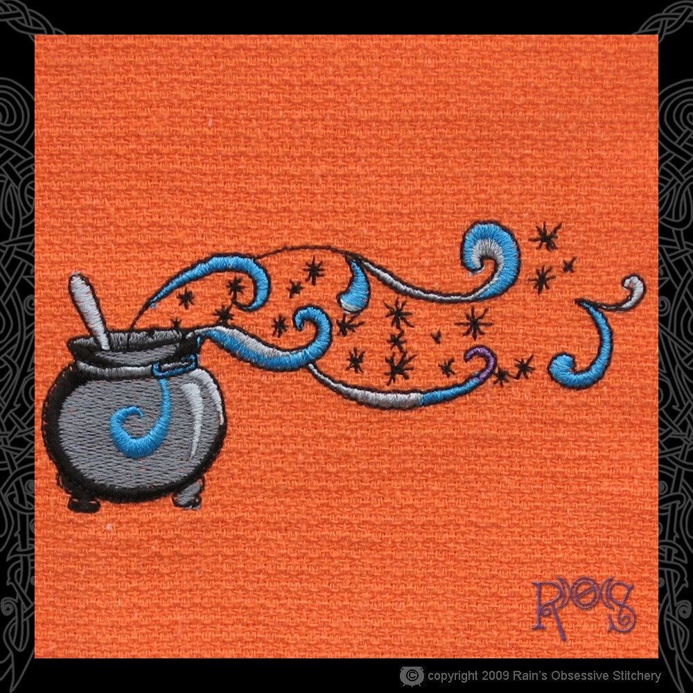 Orange Tea Towel Embroidered with Cauldron