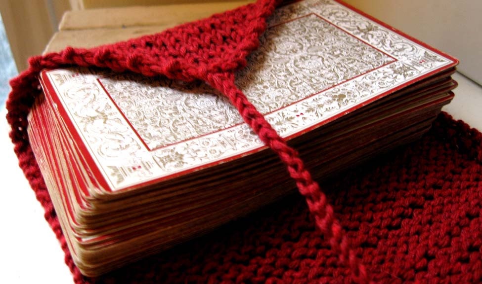 The Page tarot wrap.  knit in berry red