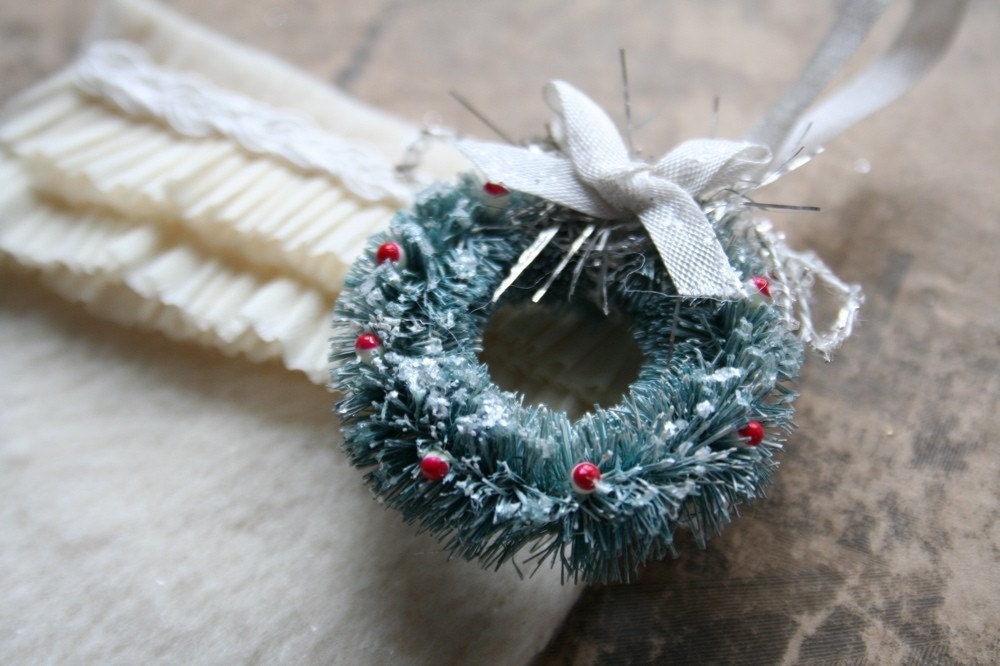handmade ruffled wool christmas stocking with tiny bottle brush wreath