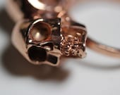 one of us. conjoined twin skull ring. rose gold vermeil.