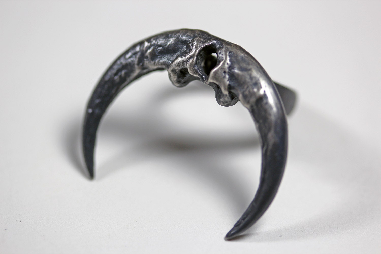 naja ring. owl talon crescent.