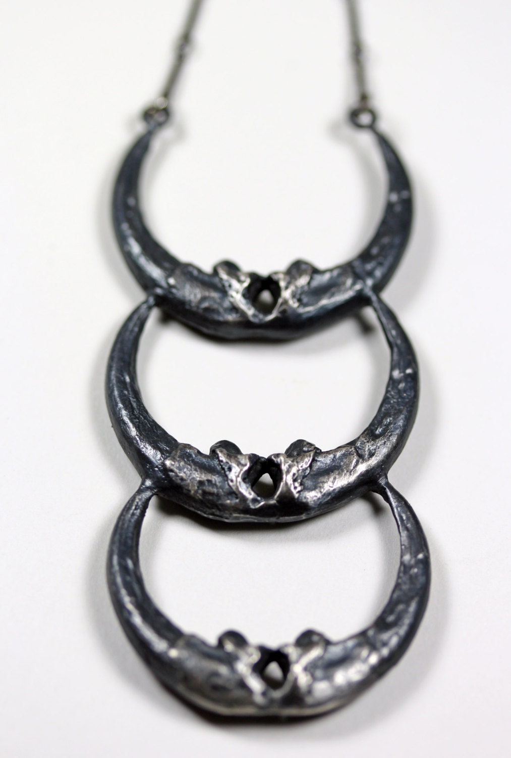 new moon. triple owl talon crescent necklace.