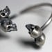 one of us. conjoined twin skull by-pass cuff.