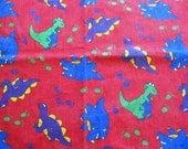 red denim dinosaur print vintage fabric piece