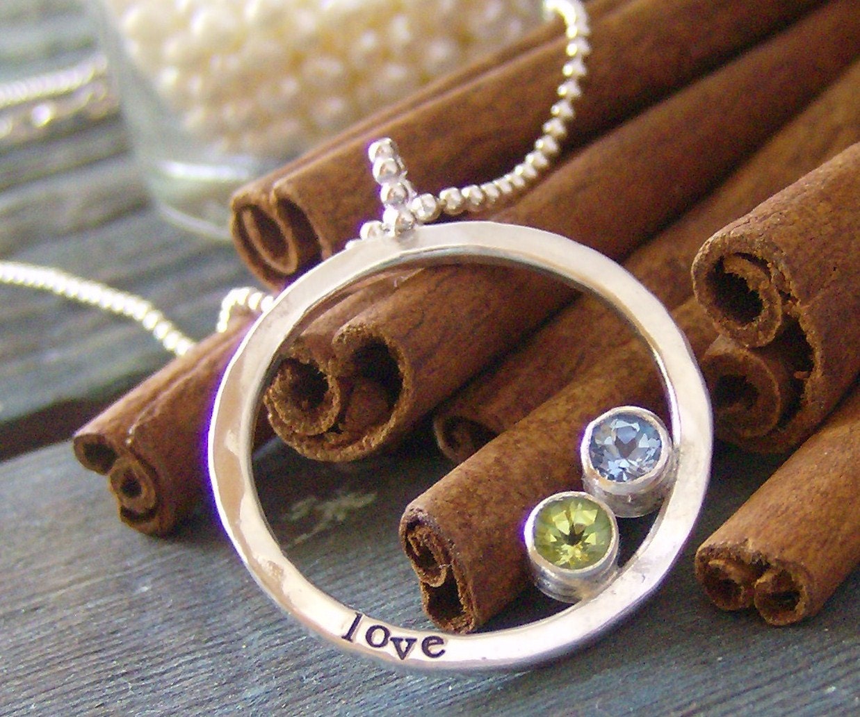 hand stamped personalized eternity ring set with faceted gem stones