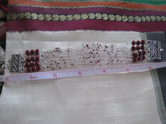 Knitted  wire bracelet in  sterling silver and red