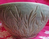 Large green bowl with carvings