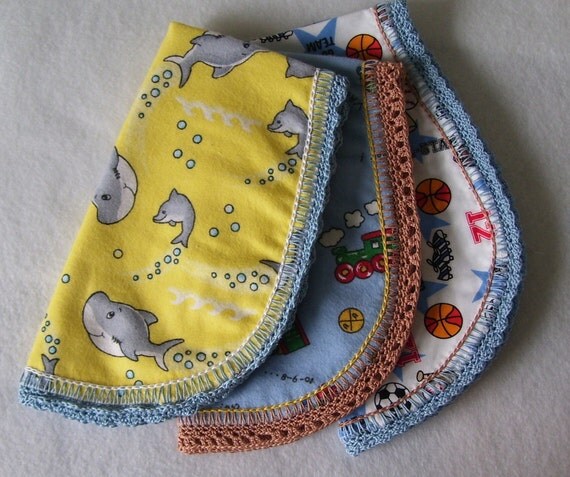Baby Dolphin Burp Pad Cloth is handmade and perfect for the little person in your life made in the USA a blue hand crocheted edge
