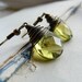 Olive juice - Antiqued brass wire wrapped light olive green glass earrings