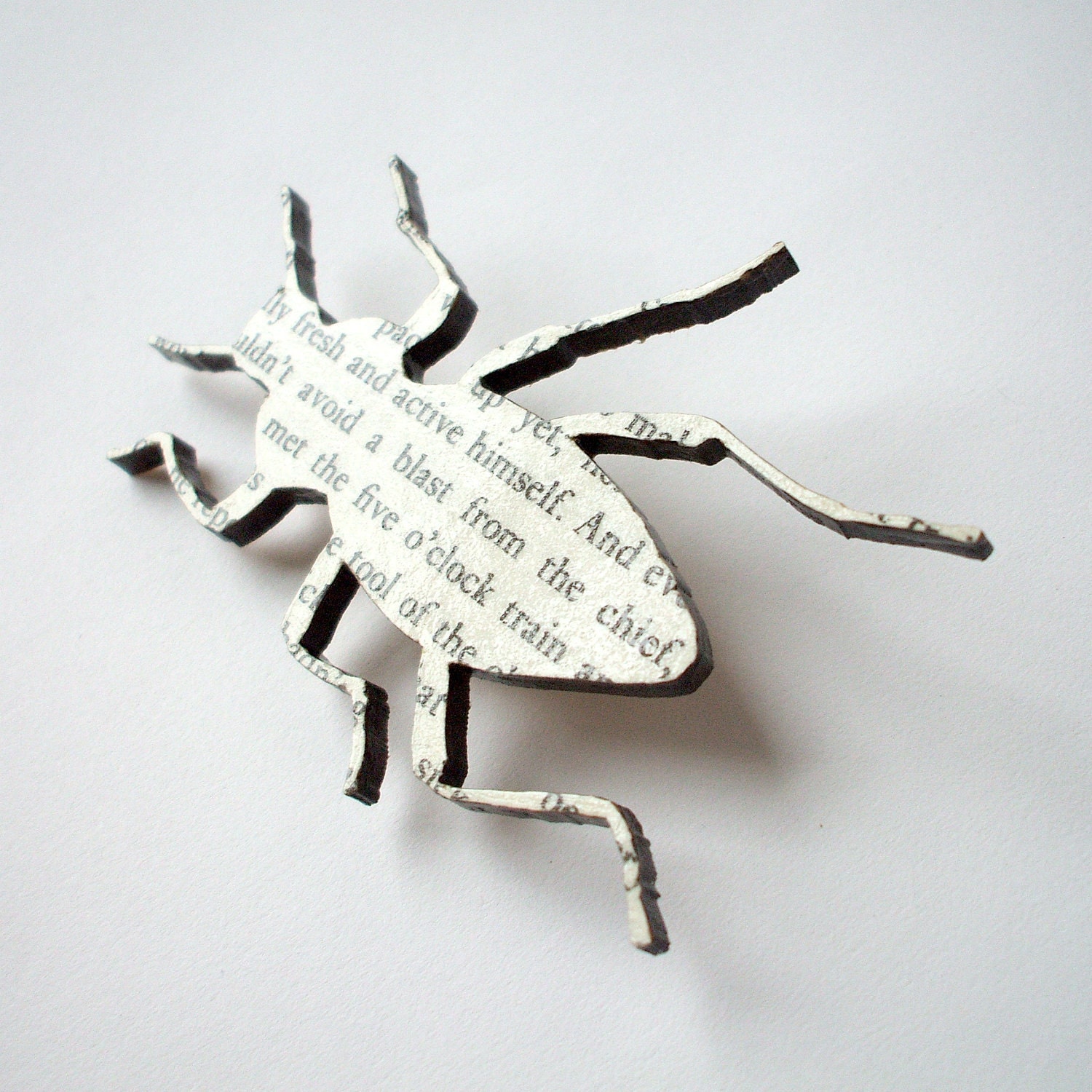 Franz Kafka - The Metamorphosis beetle brooch. Classic book brooches made with original pages.