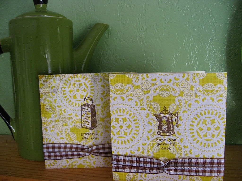 Two greeting cards, vintage style cheese grater and percolator