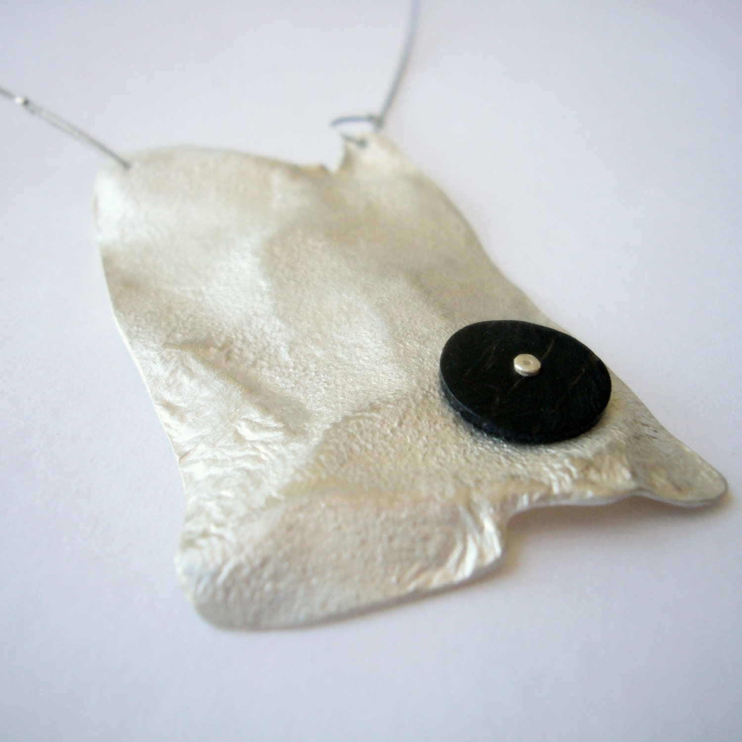 Sol pendant, sterling silver, wood, modern contemporary jewelry, organic, ebony, concentric, circle,
