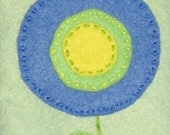 Blue, Green, and Yellow Lollipop Flower on Light Green Tissue Cozy