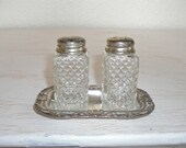 vintage pressed glass salt and pepper shakers on ornate silver tray - shabby cottage chic - hollywood regency