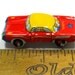 60s tin toy CAR, red with blue & yellow, from Japan.