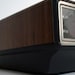 Vintage 1970s General Electric alarm clock with red digital numbers and woodgrain exterior