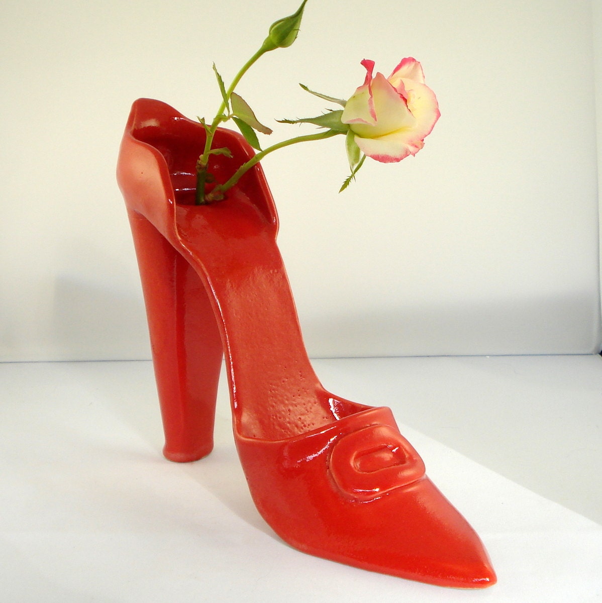 Stylish red shoe bud vase and potpourri container