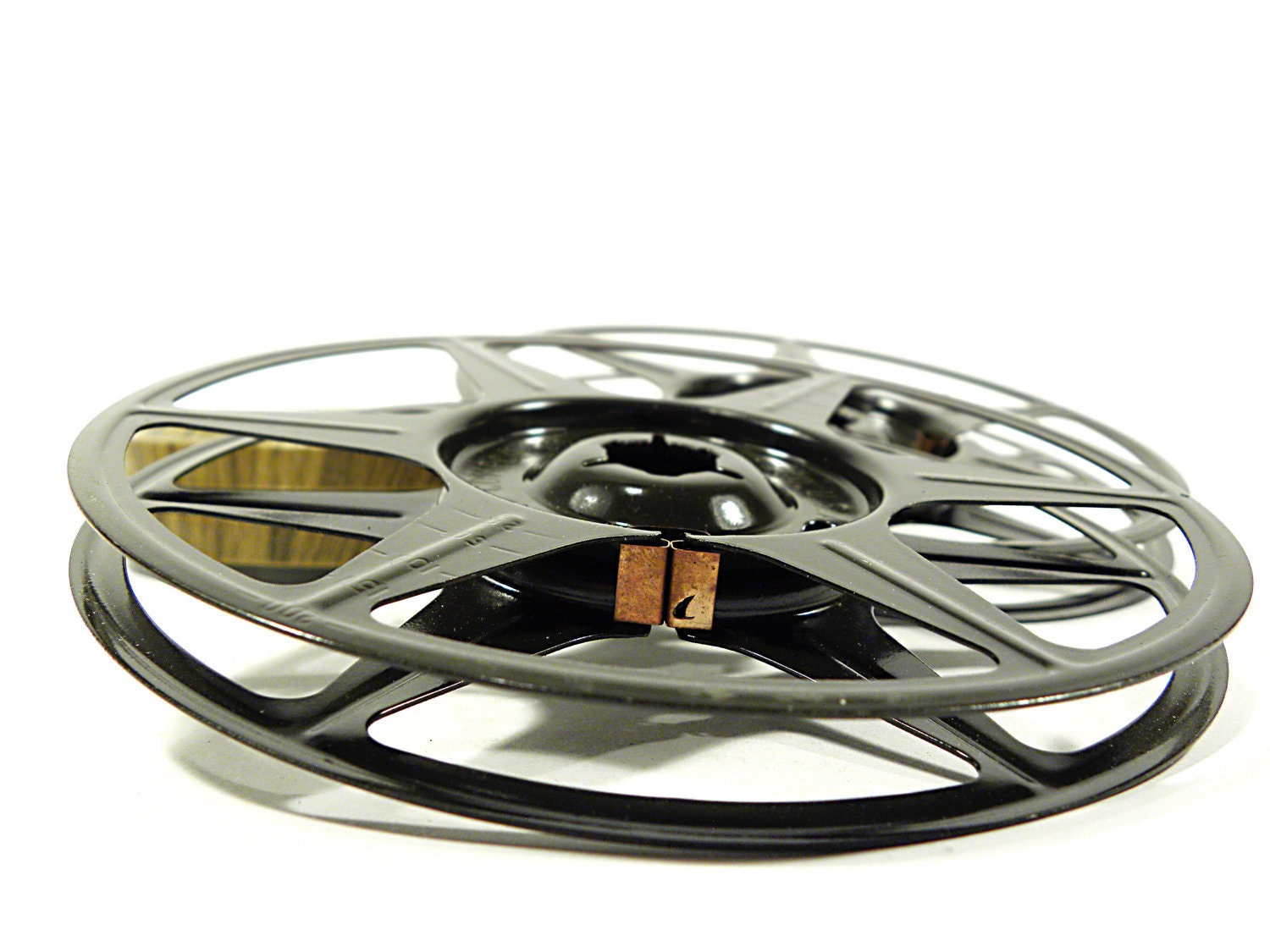 2 faux bois steel film canisters and reels . 8MM