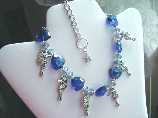 royal blue faceted glass, sea horses ... Tahiti Derby