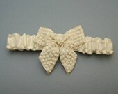 Ivory beaded bow garter