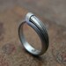 Ouroboros Ring, contemporary design, in textured, hammered and oxidized silver. Made to order, needs three weeks to complete