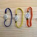 YELLOW FLUOR Fake watch with elastic watchband bracelet. Porcelain toy clock