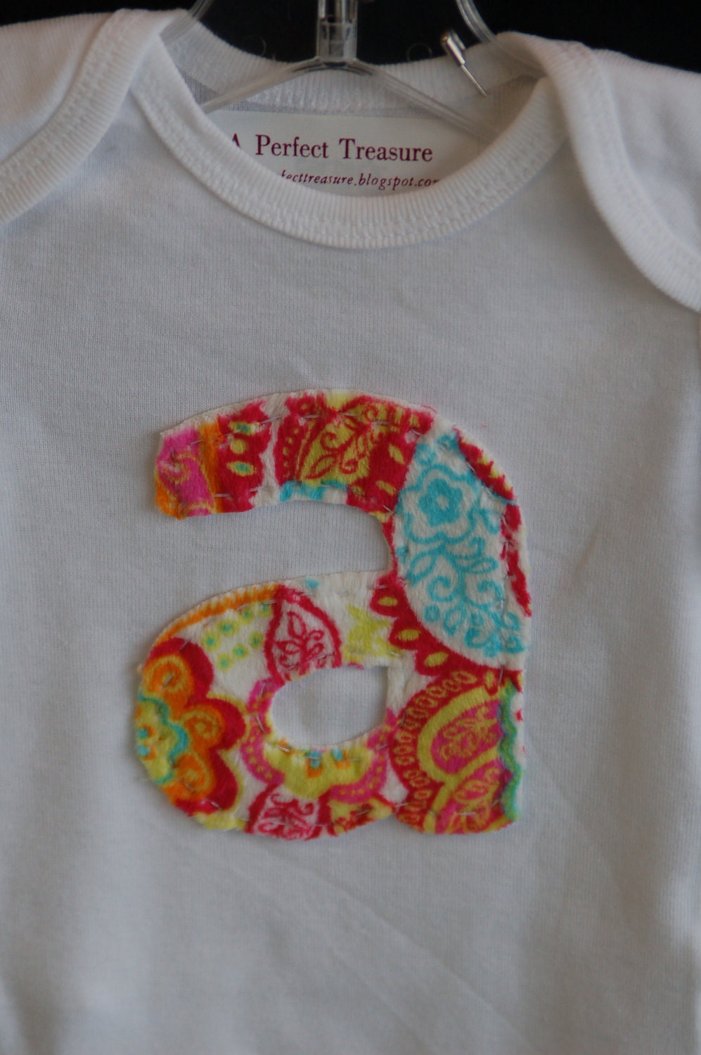 initial onesie.  monogrammed shirt for your favorite little guy or gal.  coupon available.
