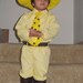man in yellow hat costume curious george