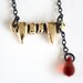 gold vampire fang - swarovski crystal - black necklace