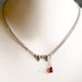 gold vampire fang - swarovski crystal - black necklace