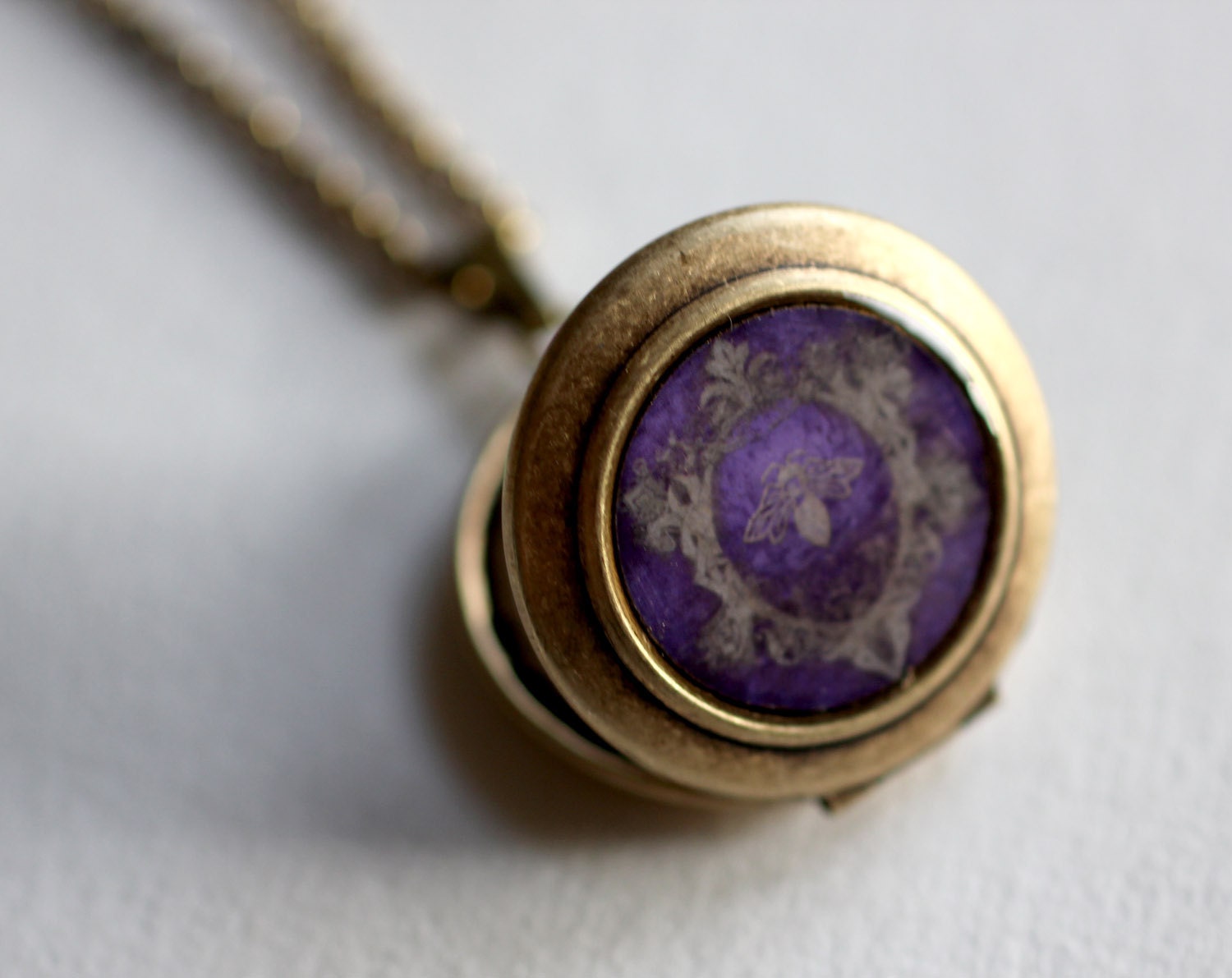 Art Locket Necklace featuring a Honey Bee - The purple, iconic pendant looks vintage with a romantic flair