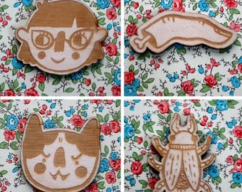 Finger, Girl, Cat, or Beetle Brooch