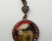 Art pendant necklace, antiqued brass , quirky creature image, Ruby red Hawatha crystalized Gems