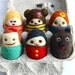 Set of 6 tiny egg people in egg carton and one egg dog
