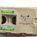 Set of 6 tiny egg people in egg carton and one egg dog