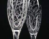 Two Hand Engraved Glass Champagne Flutes . 'Reaching Branches'  and  'Branches and Leaves'