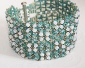 Light Green, Soft Blue, and White Opals Highlighted with Gold Beads