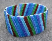 Beaded Cuff Bracelet - Multicolored Colorful Blue Green Purple Dark Red Diagonal Stripe by randomcreative on Etsy