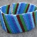 Beaded Cuff Bracelet - Multicolored Colorful Blue Green Purple Dark Red Diagonal Stripe by randomcreative on Etsy