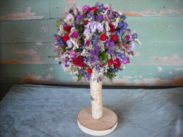 Dried flower topiary with birch log stem in your choice of colors. A nice wedding centerpiece.