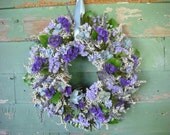 Dried flower wreath in shades of violet, blue and lavender.