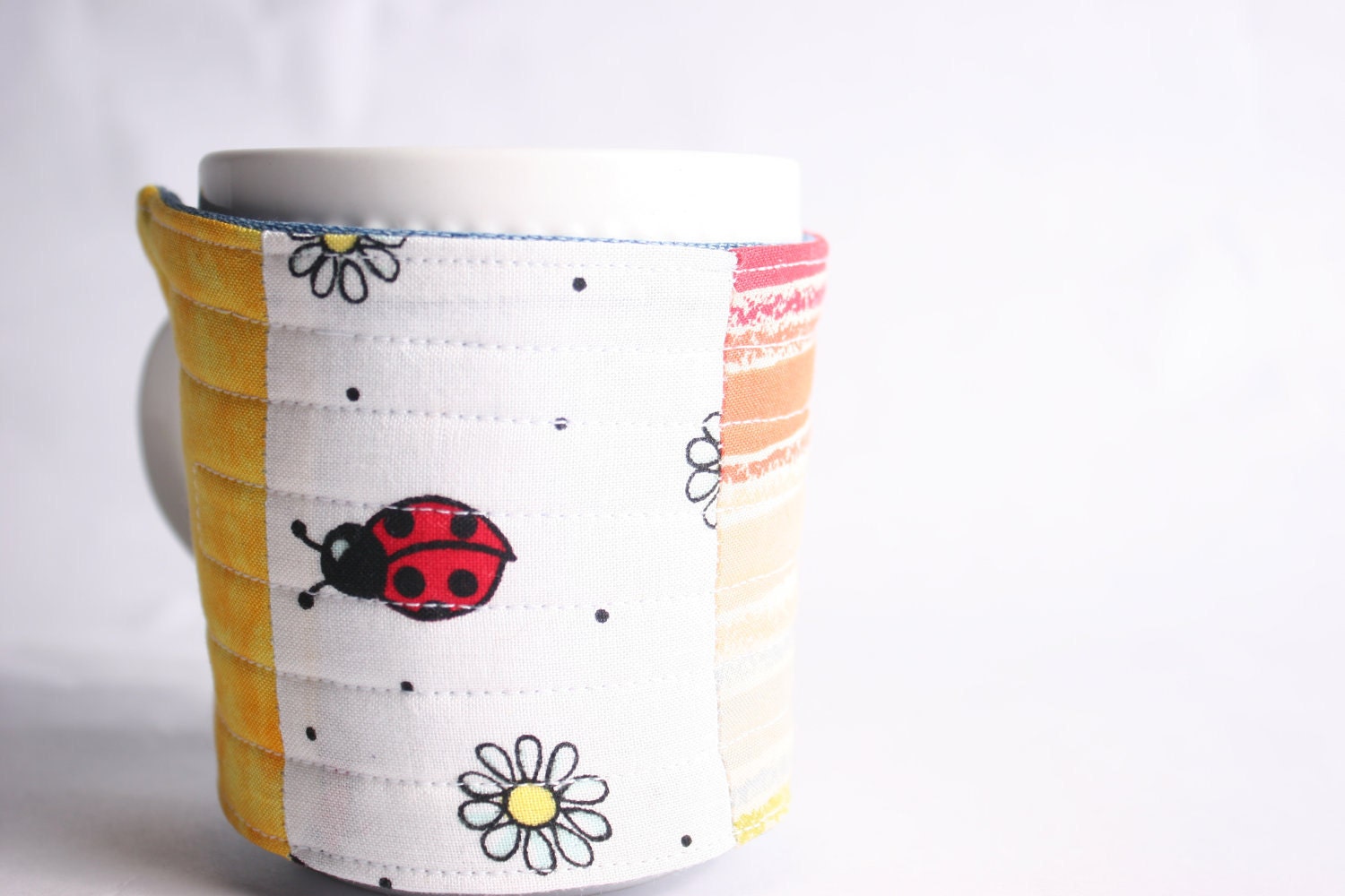 coffee mug cozy, reuseable mug cozy, quilted fabric red, orange, yellow: Ladybug
