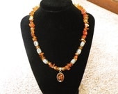 Red agate and silver necklace w/ antique amber pendant.