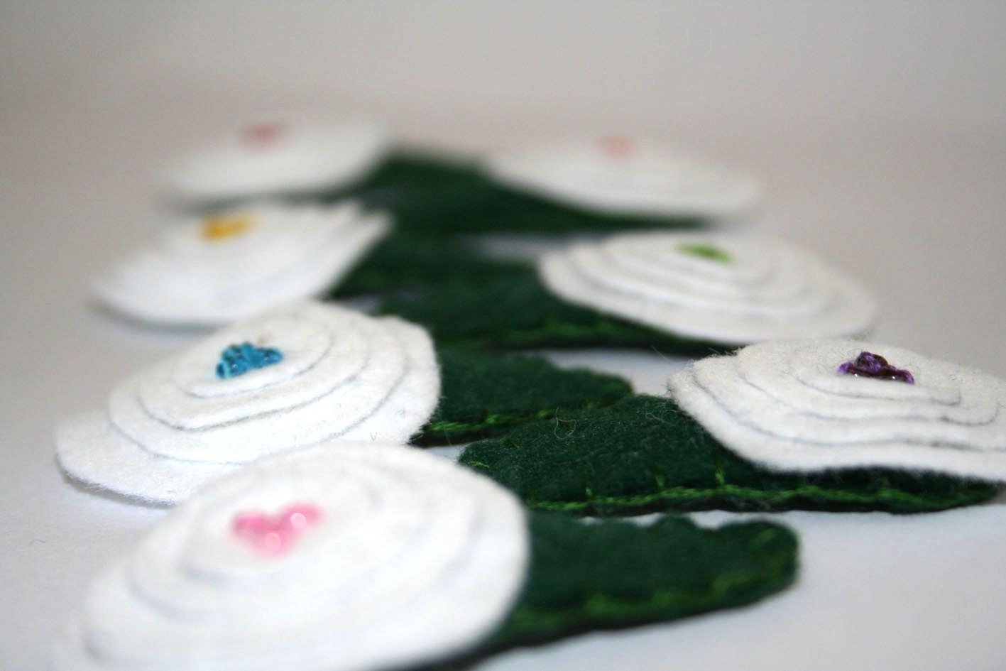 White rosette with green beads hair clip