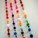 Party Yarn Pom Pom Garland, pom poms, beads, balls, scarf, purple, green, yellow, red, purple, orange, mobile, blue, brown, pink, 15 feet