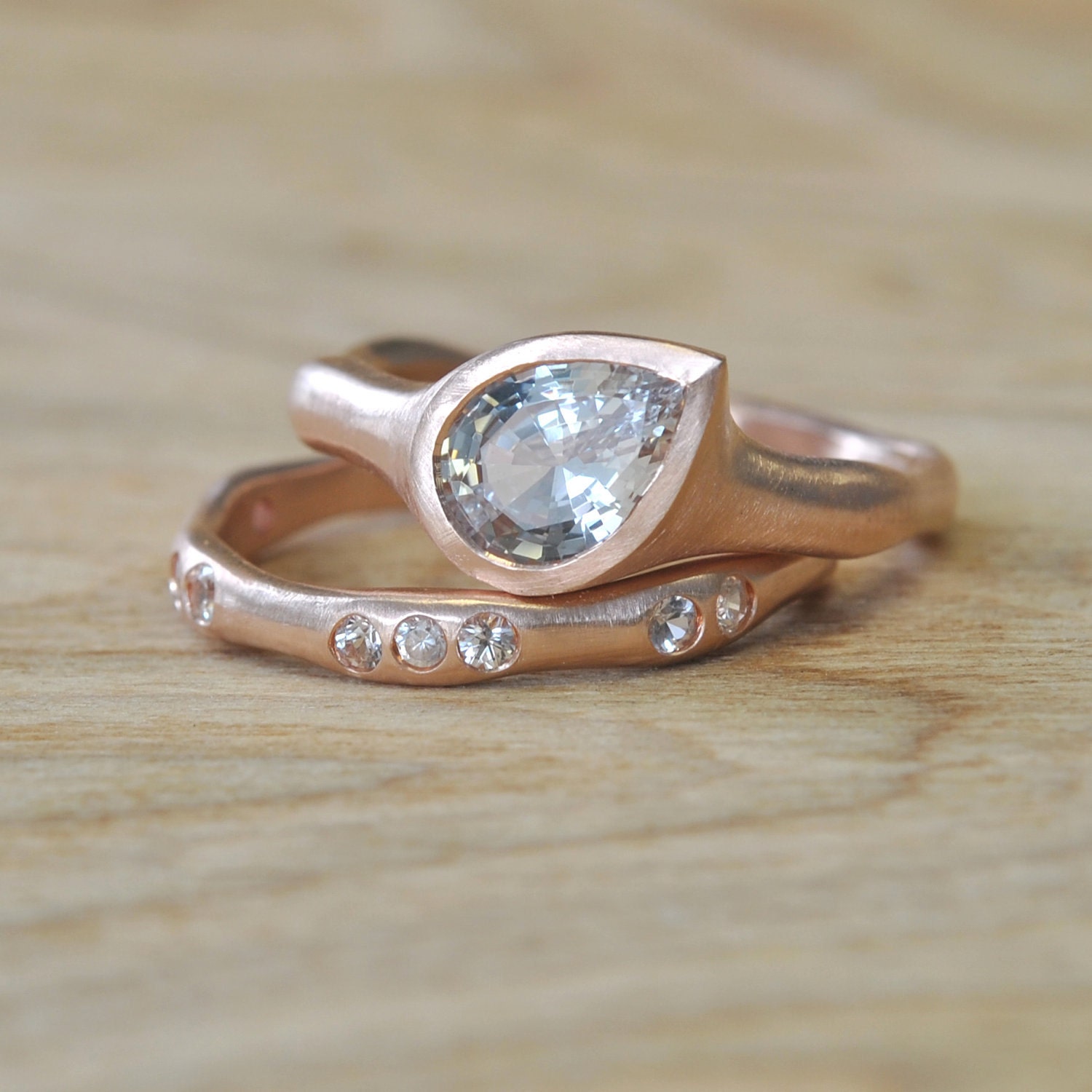 Brilliant Moissanite Teardrop Set in Rose Gold