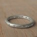 Moissanite and Silver Eternity Band
